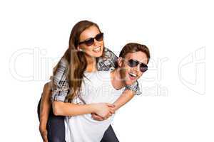 Smiling young man carrying woman