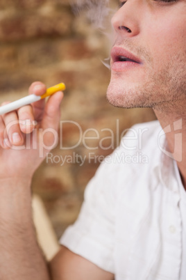 Businessman smoking an electronic cigarette