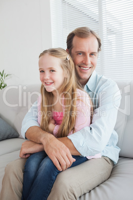 Casual father and daughter on the couch