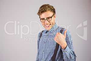 Geeky hipster showing thumbs up