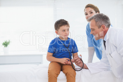 Doctor showing how to use a stethoscope