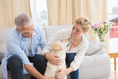 Happy couple with their pet dog