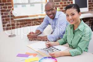 Casual business team working together at desk