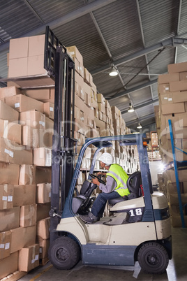 Forklift machine in warehouse