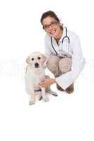 Smiling veterinarian with a cute dog