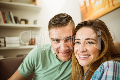 Cute couple relaxing on couch