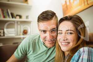 Cute couple relaxing on couch