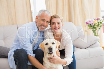 Happy couple with their pet dog