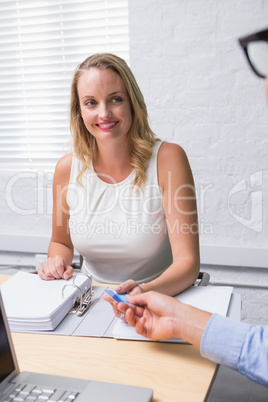 Beautiful businesswoman interviewing man