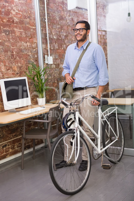 Casual businessman with his bicycle