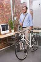 Casual businessman with his bicycle