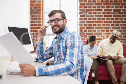 Casual businessman working at his desk