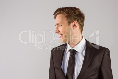 Young handsome businessman looking away