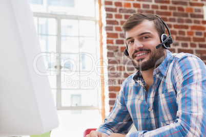 Casual businessman wearing a headset