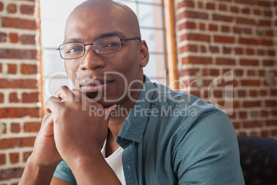 Casual businessman looking at camera