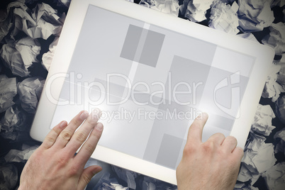 Hands touching tablet screen
