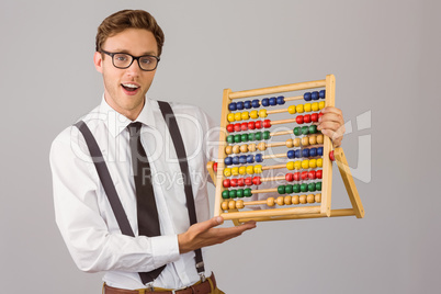 Geeky businessman using an abacus