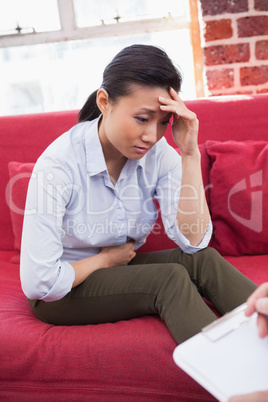 Depressed patient sitting on couch