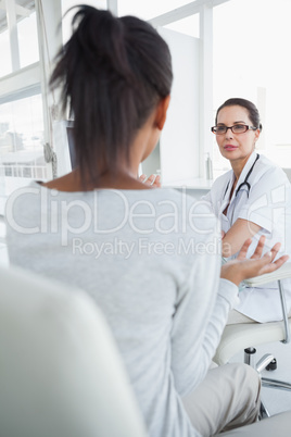 Doctor talking to her patient