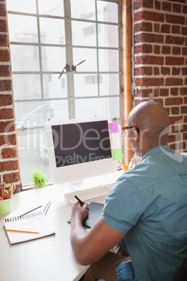 Casual businessman working at his desk