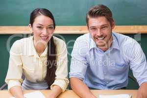 Casual business team smiling at camera during meeting