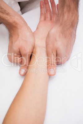 Manicurist washing customers hand