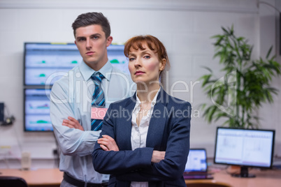 Stern technicians standing at the camera with arms folded