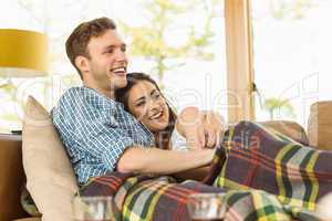 Happy young couple relaxing on the couch