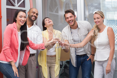 Casual business team toasting with champagne