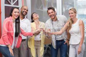 Casual business team toasting with champagne