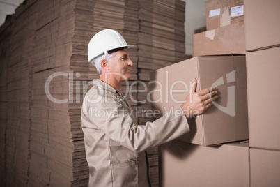 Warehouse worker loading up pallet