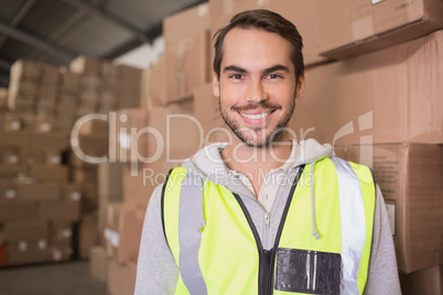 Smiling manual worker in warehouse Smiling manual worker in warehouse