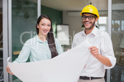 Casual architecture team working together at desk