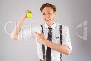 Geeky businessman lifting a dumbbell
