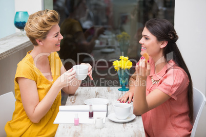 Pretty friends having a coffee