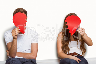 Couple holding broken heart