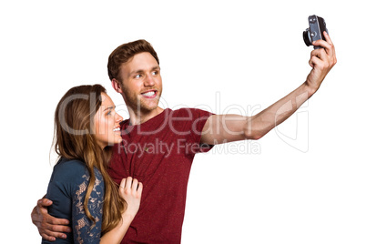 Couple taking selfie with digital camera