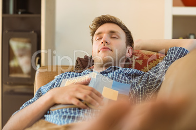 Young man napping on his couch