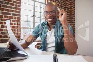 Casual businessman working at his desk