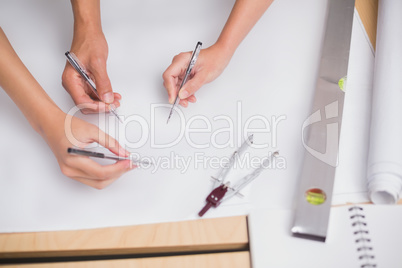 Architecture team working together at desk