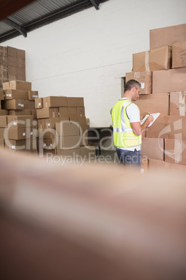 Warehouse worker with clipboard