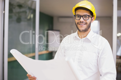 Casual architect studying his blueprints