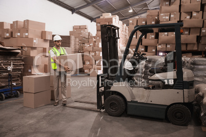 Warehouse worker loading up pallet