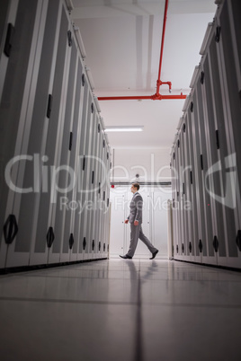 Technician walking in server hallway