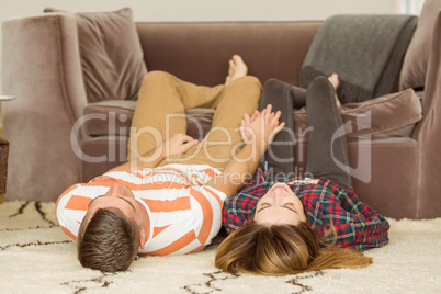 Cute couple lying on floor