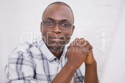 Man wearing glasses smiling at camera