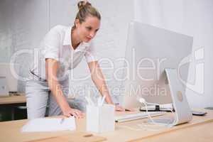 Businesswoman using computer at office