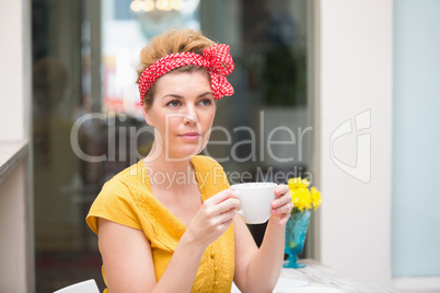 Pretty hipster holding a mug Pretty hipster holding a mug