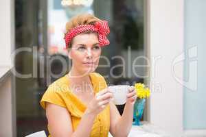 Pretty hipster holding a mug