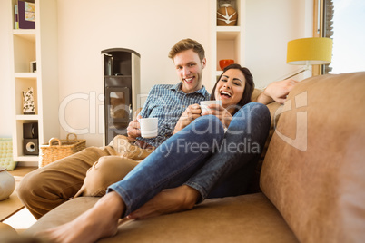 Happy young couple relaxing on the couch